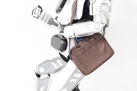 Modern robot is running with handbagの写真素材