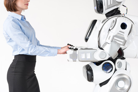 Elegant girl is enjoying time with androidの写真素材