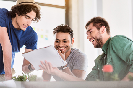 Creative male colleagues discussing new projectの写真素材