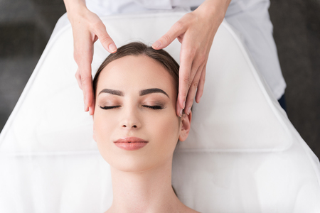 Relaxing facial massage at spa salonの写真素材