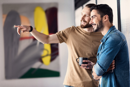 Hilarious smiling male people planning somethingの写真素材