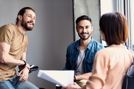 Joyous office team working togetherの写真素材