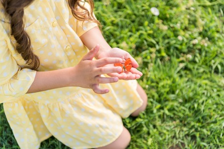 Cute little female child playing with beautiful mothの写真素材