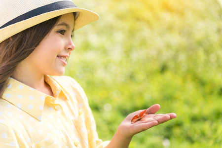 Cute female child enjoying beauty of natureの写真素材