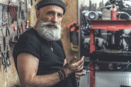 Relaxed old man cleaning handsの写真素材