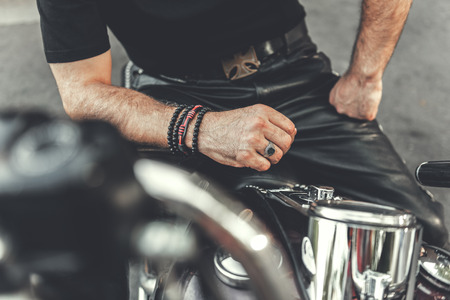 Strong man locating on motorcycle