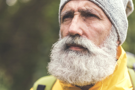 Thoughtful old man viewing natural sceneの写真素材