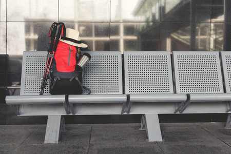 Big backpack, full of necessary things is locating at chair in waiting hall. Nobody. Copy space on right sideの写真素材