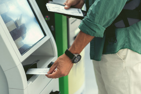 Adult traveler is enjoying modern deviceの写真素材