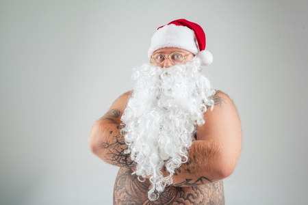 Fat Santa with bare belly posingの写真素材