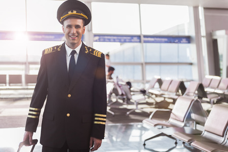 Cheerful smiling pilot in terminalの写真素材