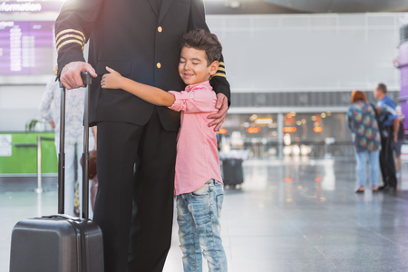 Glad little boy near pilotの写真素材