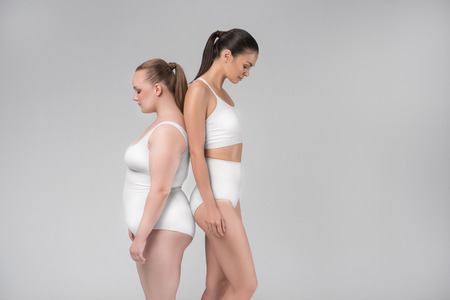 Pretty thin and tick women posing in lingerieの写真素材