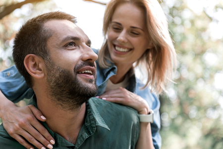 Joyful couple relaxing in forestの写真素材