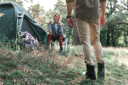 Cheerful married couple enjoying nature in forestの写真素材