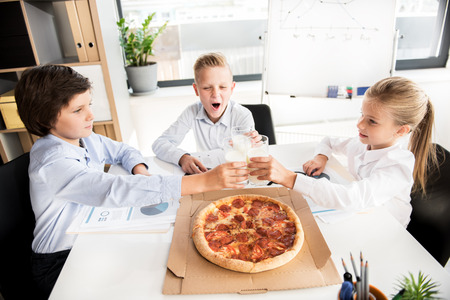 Cheerful smart children are resting togetherの写真素材