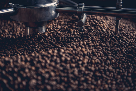 Close up brown coffee beans locating in technical equipment with grain chiller. Prepare conceptの写真素材