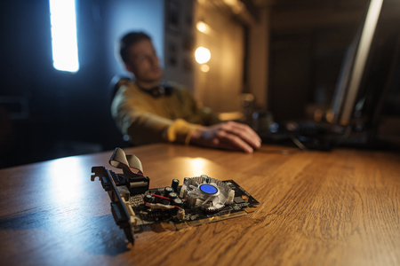 Close up cooling fan for digital device locating on desk. Male working with gadget. Technology conceptの写真素材