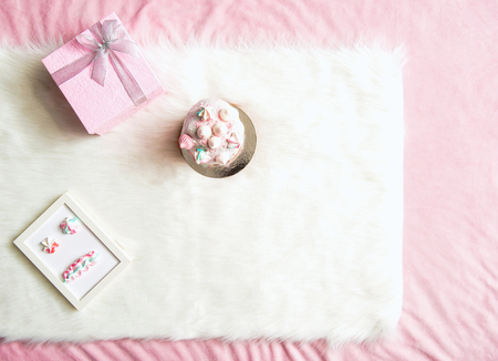 Top view cake, presents and sweets with frame situating on comfortable rug. Birthday conceptの写真素材
