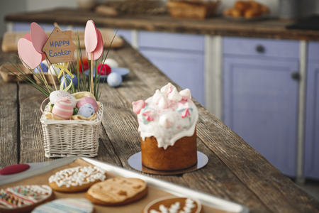 Delicious easter bakery standing on the table in the cuisine. Focus on eggs and sweet bread. Copy...