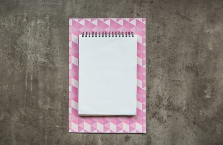 Top view close up of opened notebook situating on working area. Inspiration concept