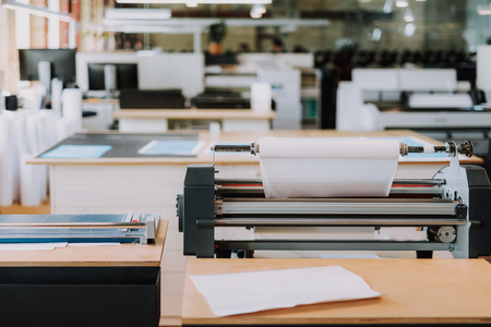 Close up of a modern printer standing on the table of the typography officeの写真素材
