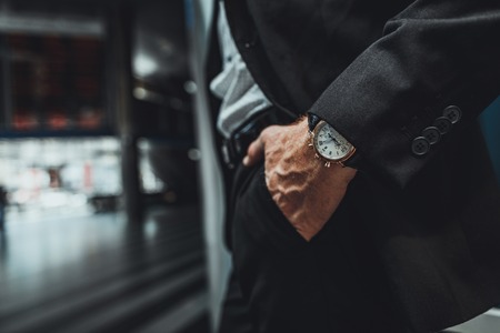 Close up of a hand of a businessman holding it in a pocket while going to workの写真素材