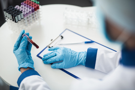 Professional facility research in healthcare system. Close up of female laboratory assistant...