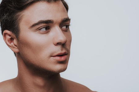 Calm Handsome Dark Haired Man Being Bare Shouldered And Looking