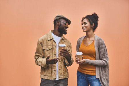 Positive nice friends drinking tasty coffee together