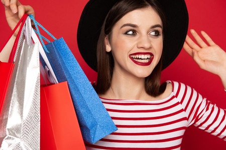 Close up happy lady with many shopping packs