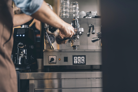 Selective focus of the espresso machine with filter holder in itの写真素材