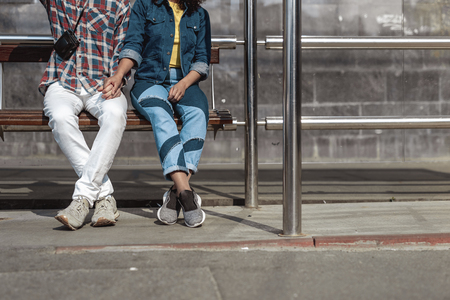 Loving couple is waiting for transport togetherの写真素材