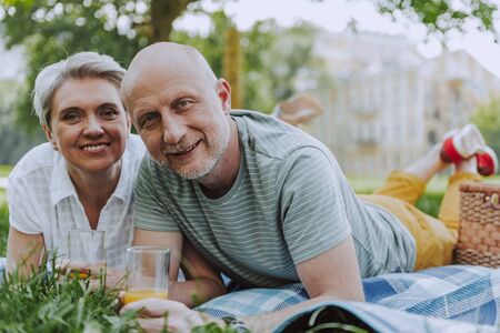 Smiling wife and husband in the park together