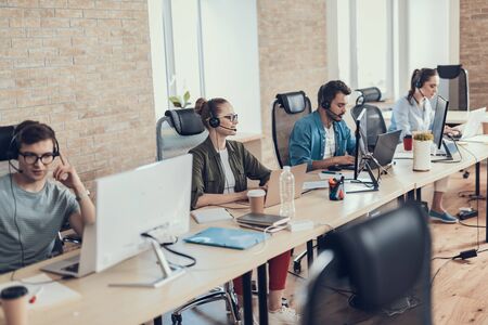 Young men and women are working in the call centerの写真素材