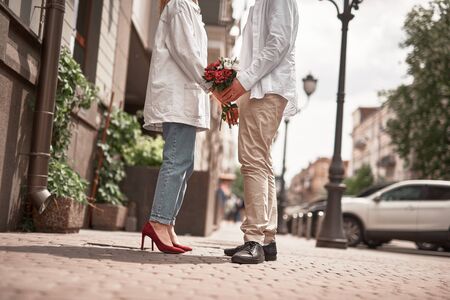 Young couple is staying outdoors in the cityの写真素材