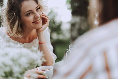 Beautiful young woman in red jacket checking flight documentsの写真素材
