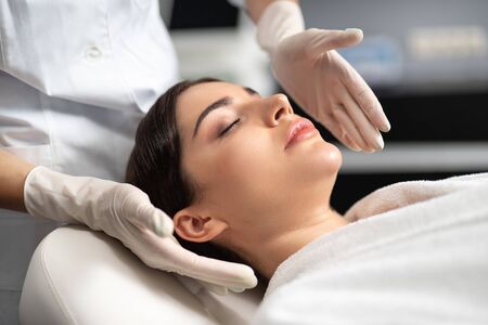 Beautiful young woman spending time at spa salonの写真素材