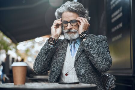 Calm mature man wearing glasses stock photo