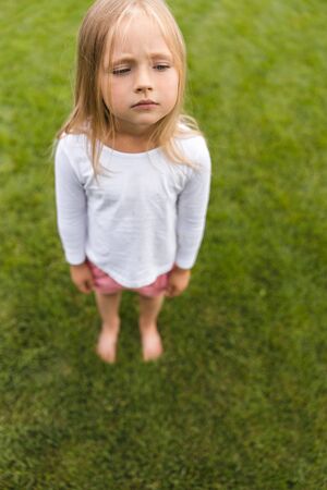 Calm child waiting for mother stock photo