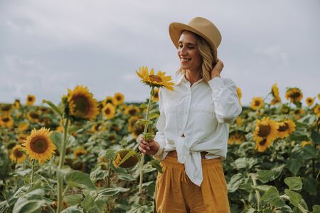 Young pretty lady posing for camera in summer outdoorsの写真素材