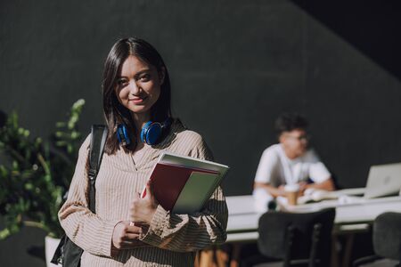 Happy beautiful female student is ready for studying