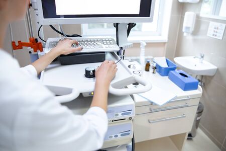 Doctor using special computer in office stock photo