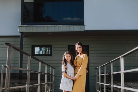 Happy mother and child is spending time outdoorの写真素材