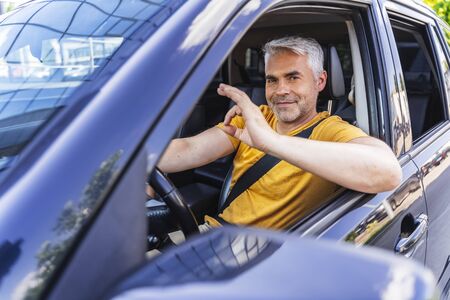 Handsome Caucasian man is posing for camera