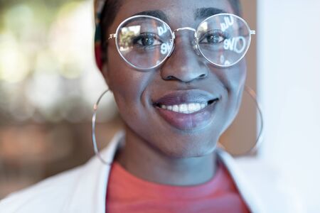 Smiling trendy woman staying indoors stock photoの写真素材