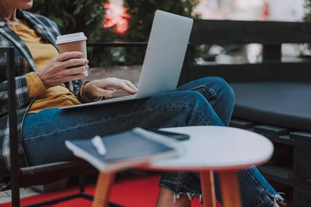 Caucasian woman freelancer with her laptop outdoorsの写真素材