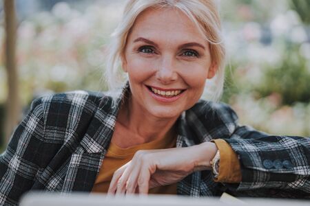 Pleased businesswoman looking in front of herの写真素材