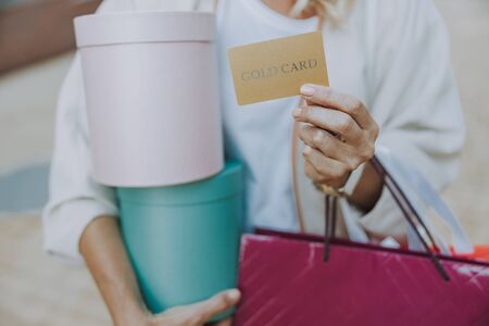 Hand of a Caucasian lady holding a cardの写真素材