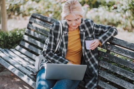 Concentrated business lady typing on a laptopの写真素材